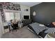 Teen bedroom features a checkered bed, desk, and shelving at 5675 E La Campana Dr, Pahrump, NV 89061