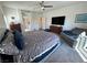 Bright bedroom with a ceiling fan, spacious layout, and lots of natural light at 5675 E La Campana Dr, Pahrump, NV 89061