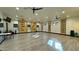 Spacious fitness center with inspirational quotes, ceiling fans, and ample natural light at 5675 E La Campana Dr, Pahrump, NV 89061
