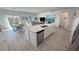 Open concept kitchen featuring stainless steel appliances and a large island at 5675 E La Campana Dr, Pahrump, NV 89061