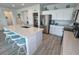 Bright kitchen showcases stainless appliances, a large island and ample countertop space at 5675 E La Campana Dr, Pahrump, NV 89061