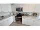 Modern kitchen design with stainless steel appliances and white countertops at 5675 E La Campana Dr, Pahrump, NV 89061
