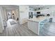 Kitchen features stainless appliances, a large island with seating and a hallway view at 5675 E La Campana Dr, Pahrump, NV 89061
