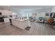 Open concept kitchen flows into the living area, featuring stainless appliances and island at 5675 E La Campana Dr, Pahrump, NV 89061