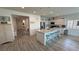 Kitchen features stainless appliances, a large island with seating, and modern finishes at 5675 E La Campana Dr, Pahrump, NV 89061