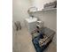 Laundry room with washer, dryer, shelving, and space for a dog crate at 5675 E La Campana Dr, Pahrump, NV 89061