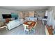 Open-concept living area featuring a dining area, kitchen with bar seating, and comfortable living space at 5675 E La Campana Dr, Pahrump, NV 89061