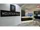 Inviting lobby entrance with elegant marble floors and Mountain Falls signage at 5675 E La Campana Dr, Pahrump, NV 89061