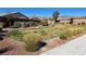 Community park featuring a bench surrounded by well-maintained landscaping and rock borders at 5675 E La Campana Dr, Pahrump, NV 89061