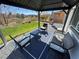 Outdoor patio space with gazebo, comfortable seating, and views of the green, manicured lawn at 5675 E La Campana Dr, Pahrump, NV 89061