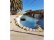 Outdoor space with a rock-lined pool and rock landscaping, creating a serene retreat at 5809 Pebble Beach Blvd, Las Vegas, NV 89108