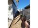 Side yard featuring a dirt path and chain link fence, ready for customization at 5809 Pebble Beach Blvd, Las Vegas, NV 89108