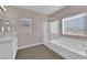 Serene bathroom with a soaking tub, separate shower, and natural light at 5832 Sleepy Willow St, Las Vegas, NV 89148