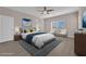 Bright bedroom boasts ample natural light, stylish decor, and a comfortable king-size bed at 5832 Sleepy Willow St, Las Vegas, NV 89148