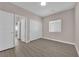 Bright bedroom with wood-look flooring, closet and natural light at 5832 Sleepy Willow St, Las Vegas, NV 89148