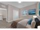 Cozy bedroom features a queen bed, a view from the window, and a neutral color palette at 5832 Sleepy Willow St, Las Vegas, NV 89148