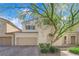 Charming two-story home with a two car garage and mature landscaping at 5832 Sleepy Willow St, Las Vegas, NV 89148