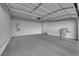 Spacious two-car garage featuring ample storage space, an automatic door opener, and a clean, well-lit environment at 5832 Sleepy Willow St, Las Vegas, NV 89148