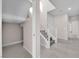 Hallway features a staircase, neutral paint, tile flooring, and a bright, airy feel at 5832 Sleepy Willow St, Las Vegas, NV 89148