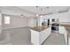 Open layout kitchen features granite countertops, stainless steel appliances and an island at 5832 Sleepy Willow St, Las Vegas, NV 89148