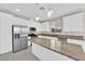 Modern kitchen with white cabinetry, stainless steel appliances, granite countertops and island at 5832 Sleepy Willow St, Las Vegas, NV 89148