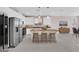 Spacious kitchen with modern appliances, a large island with barstool seating, and white cabinetry at 5832 Sleepy Willow St, Las Vegas, NV 89148