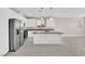 Open concept kitchen features granite counters, stainless appliances, an island and tile floors at 5832 Sleepy Willow St, Las Vegas, NV 89148