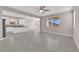 Spacious living room boasts tile floors, recessed lighting and seamlessly connects to the kitchen at 5832 Sleepy Willow St, Las Vegas, NV 89148