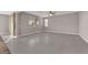 Open-concept living room features tile flooring, large windows, and access to outdoor spaces at 5832 Sleepy Willow St, Las Vegas, NV 89148
