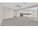 Bright living area with tile flooring that leads to a well-equipped kitchen with stainless steel appliances at 5832 Sleepy Willow St, Las Vegas, NV 89148