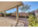 A charming covered patio offers a relaxing outdoor space in the low maintenance backyard at 5977 Ancient Peaks Ave, Las Vegas, NV 89141