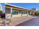 This home features a covered patio and low-maintenance desert landscaping at 5977 Ancient Peaks Ave, Las Vegas, NV 89141