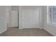 Bedroom features carpet, closet doors, and plantation shutters at 5977 Ancient Peaks Ave, Las Vegas, NV 89141