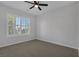 Bedroom featuring carpet, white plantation shutters, and ceiling fan at 5977 Ancient Peaks Ave, Las Vegas, NV 89141