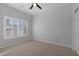 Bedroom featuring neutral walls, a window with shutters, and a ceiling fan at 5977 Ancient Peaks Ave, Las Vegas, NV 89141