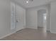 Bright foyer featuring neutral walls, tile floors, an arched doorway, and a clear view into other rooms at 5977 Ancient Peaks Ave, Las Vegas, NV 89141