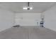 Spacious garage with concrete flooring and lighting at 5977 Ancient Peaks Ave, Las Vegas, NV 89141