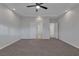 Large main bedroom with plush carpet, a ceiling fan and a private bath and closet at 5977 Ancient Peaks Ave, Las Vegas, NV 89141