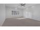 Spacious main bedroom with plush carpet, recessed lights and bright shuttered windows at 5977 Ancient Peaks Ave, Las Vegas, NV 89141