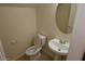 Half bathroom featuring a pedestal sink, modern toilet, and neutral wall color at 6020 Genovese Ave, Las Vegas, NV 89141