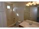 Bright bathroom features a shower/tub combo, vanity sink, and good lighting at 6020 Genovese Ave, Las Vegas, NV 89141