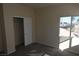 Bright bedroom offers a closet and window overlooking the neighborhood at 6020 Genovese Ave, Las Vegas, NV 89141