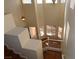 Foyer boasts tall ceilings, natural light, a pendant light, and staircase with wood flooring at 6020 Genovese Ave, Las Vegas, NV 89141