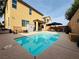 Inviting backyard featuring a private pool, patio seating, and well-maintained landscaping at 6495 Little Harbor Ct, Las Vegas, NV 89141