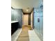 Well-lit bathroom featuring a walk-in shower with marble tiling and a dark vanity with a white marble countertop at 6495 Little Harbor Ct, Las Vegas, NV 89141