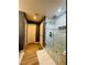 Modern bathroom with a glass shower and stone tile flooring at 6495 Little Harbor Ct, Las Vegas, NV 89141