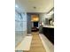 Bathroom featuring a large walk-in shower, a dark vanity with a white countertop, and wood flooring at 6495 Little Harbor Ct, Las Vegas, NV 89141