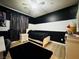 Bedroom featuring a black and white color scheme with a bed, a nightstand, and a desk at 6495 Little Harbor Ct, Las Vegas, NV 89141