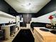 Cozy bedroom featuring a ceiling fan, desk and storage, and trendy black and white decor at 6495 Little Harbor Ct, Las Vegas, NV 89141