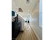 Bright hallway with wood floors, leading to living area with lots of natural light, enhancing the home's appeal at 6495 Little Harbor Ct, Las Vegas, NV 89141